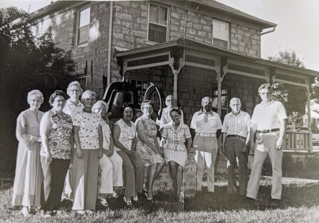 Heritage House in 1977
Back Row: Mrs. Lois Nielsen, Mrs. Sigvald Jensen, I. C. G. Campbell, Henry Smith, Dr. L. N. Kunkel, Robert Forest
Front Row: Mrs. Eugene Domingo, Mrs. Robert Forest, Mrs. Henry Smith, Kathryn Ellis, Mrs. Alfred Peterson, Mrs. L. N. Kunkel